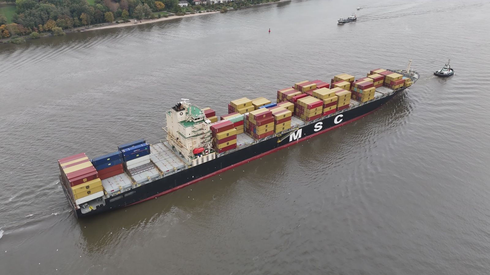 Container vessel navigating a shipping channel